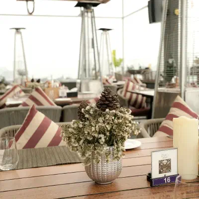 Picture QR code showcase: qr code with a logo on a table in a restaurant